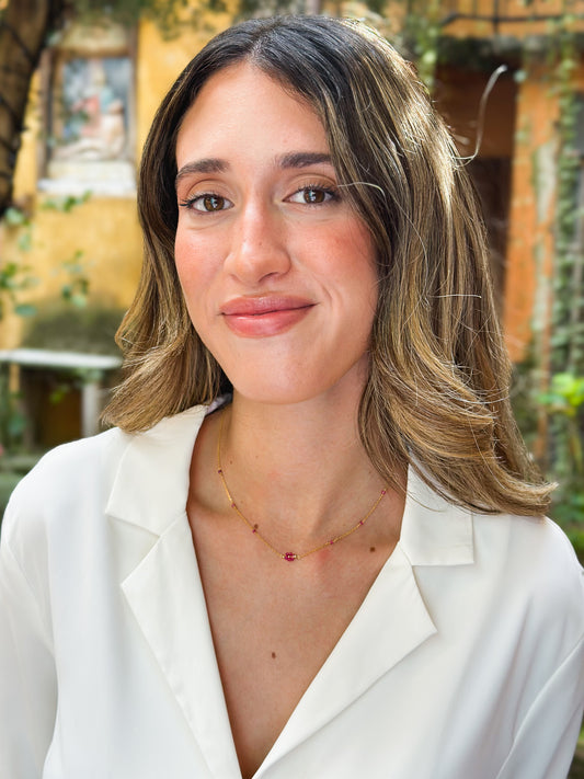 Girocollo in Oro 9kt con Fiorellino Fucsia